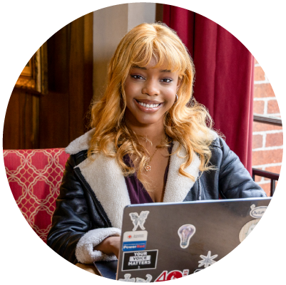 Marrylin Ogbonna with a laptop.