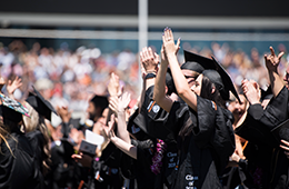 OSU Graduation with new grads in caps and gowns clapping