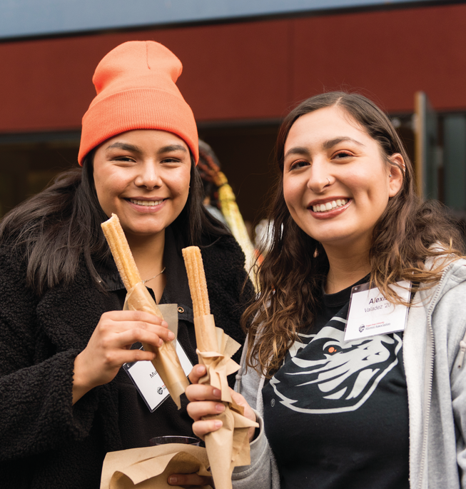 MulticulturalTG_FeaturedEventImage_653x685 Two people holding churros