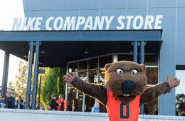 260x170_EventThumbnail_OSUAA_Nike Benny stands with open arms in front of the Nike Company Store