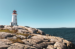 Canadian maritimes lighthouse by ocean