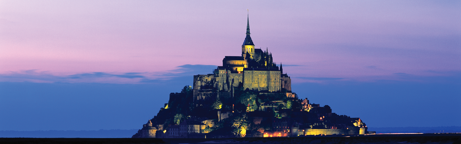 A photo of the Mont Saint Michel Abbey at sunset
