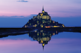 A photo of the Mont Saint Michel Abbey at sunset