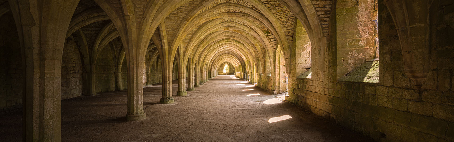 Fountains Abbey Hallway with arches and windows