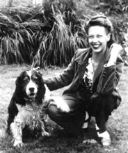 Lois Bates Acheson with her cute dog outside, in black and white
