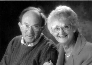 Headshots of Ernest Engler Jacobs and wife, in black and white