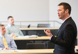 Keith Leavitt giving a lecture in a classroom