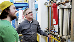 Brian G. Woods with student in a laboratory