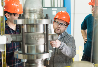 Wade Marcum in a laboratory with students