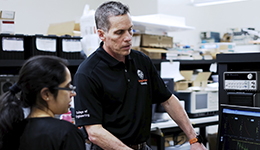 Tom Weller teaching a student in a classroom