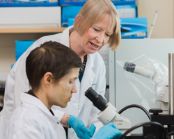 Maret G. Traber working in a laboratory with a student