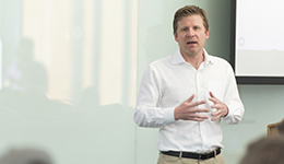 Todd Montgomery speaking in front of a classroom