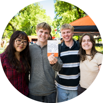 SketchBot_DPD_ImpactReport26 Students holding a SketchBot illustration.