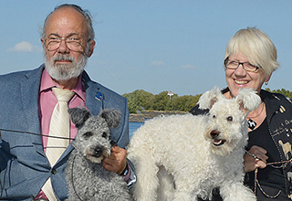 Tom and Chris Levy and pups