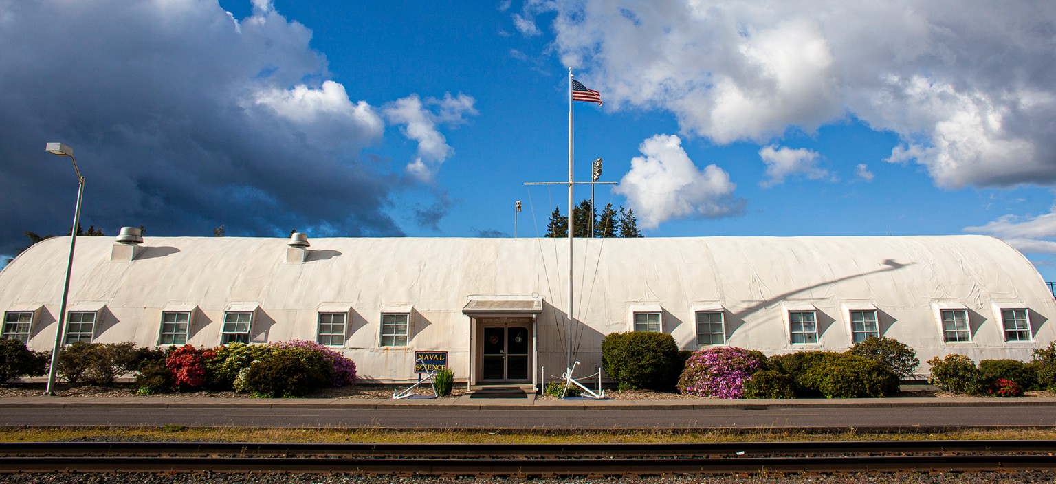 The Navy building on OSU by a railroad track.