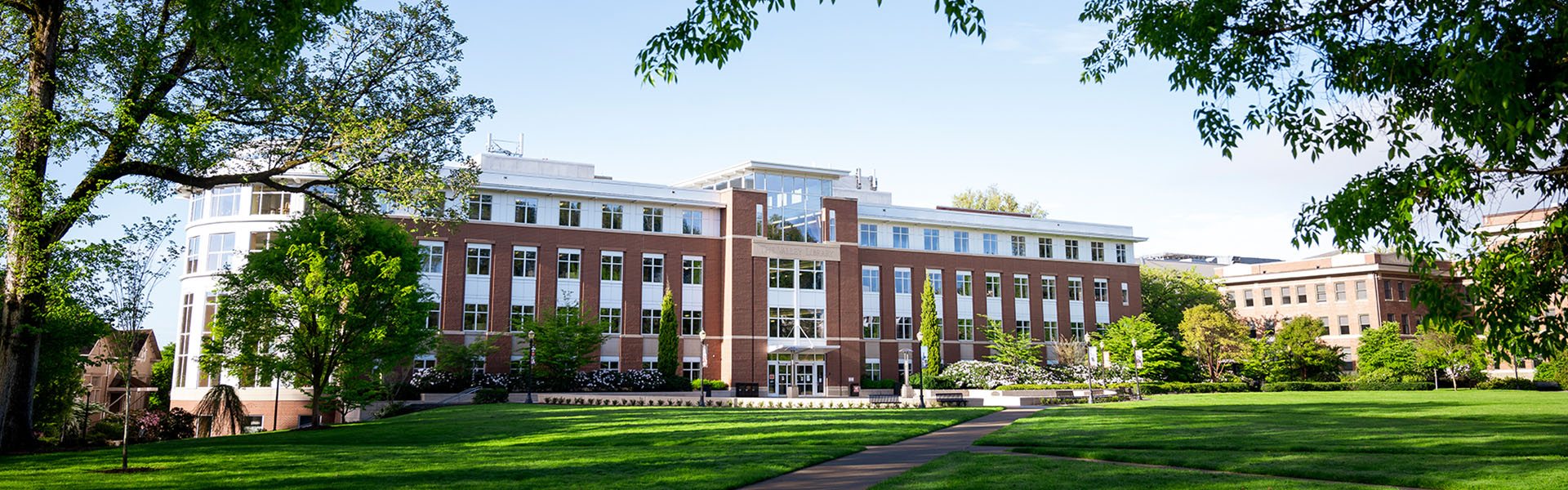 OSU Valley Library with blue skies and green grass