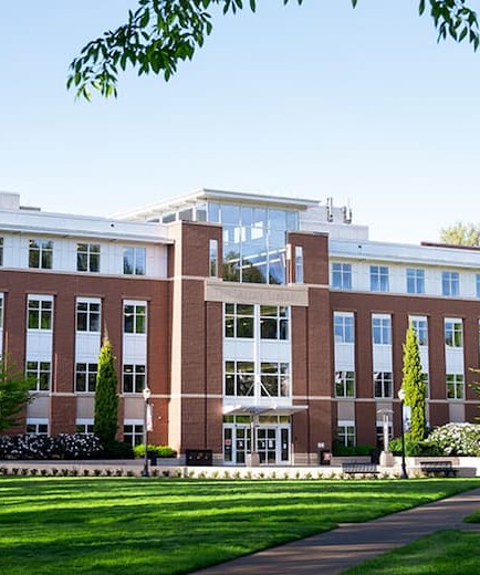 OSU Valley Library with blue skies and green grass