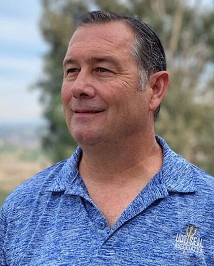 Headshot of Jay Washabaugh. He's looking off to the side and smiling.