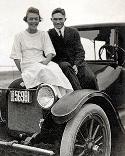 two people on a car