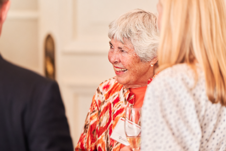 Candid phot of Peggy Wood smiling in a group.