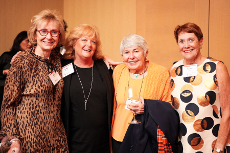 Peggy Wood standing with a group of women smiling.