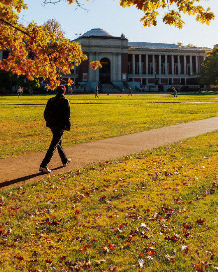 Person walking towards MU on a Fall day.