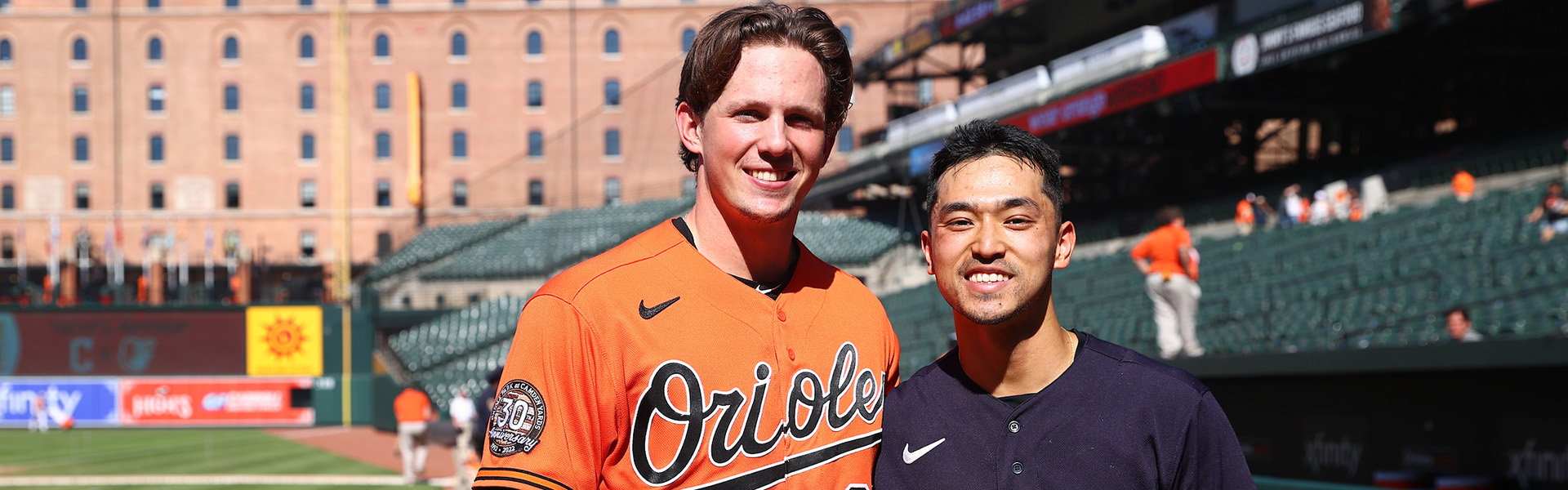 two baseball players standing side by side