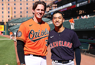 two baseball players standing side by side