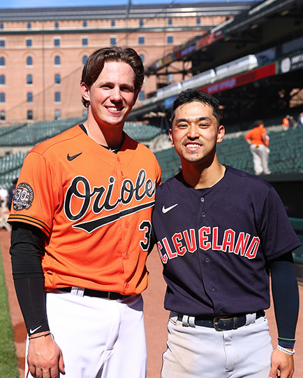 two baseball players standing side by side