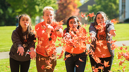 OSU students blowing leaves.