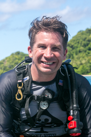 Derek Abbey smiling in scuba gear