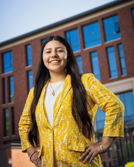 Yazeli smiles in front of OSU's Austin Hall.