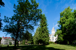 Scenic view of grass and Benton building