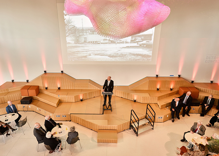 Room shot of Ed Feser giving a speech in front of guests.