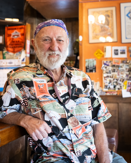 Portrait of Greg Little inside Squirrel's Bar.